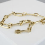 Gouden closed forever schakelarmband