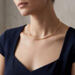 Gouden spang collier half rond