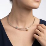 Wit gouden spang met diamant en parel