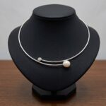 Wit gouden spang met diamant en parel