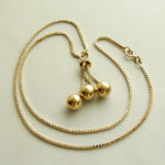 Geel gouden collier met balletjes