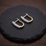 Christian bicolor gouden oorclips met zirkonia