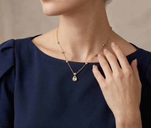 Gouden zirkonia peer hanger