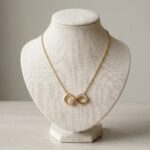 Gouden ketting en infinity zirkonia hanger