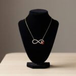 Gouden zirkonia Infinity lieveheersbeestje hanger
