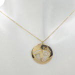 Gouden zirkonia baby hangerGouden zirkonia baby hanger