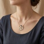 Gouden zirkonia baby en moeder hanger