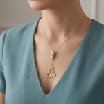 Gouden vlinder en ster hanger