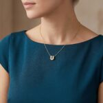 Gouden ketting met U zirkonia hanger