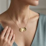 Gouden ketting met dubbele ronde hanger