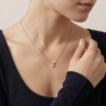 Gouden ketting met T hanger