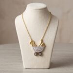Bicolor gouden babywagen met ketting