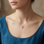 Gouden ketting met T zirkonia hanger