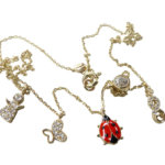 Gouden bedelketting met lieveheersbeestje
