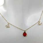 Gouden bedelketting met lieveheersbeestje