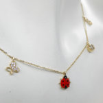 Gouden bedelketting met lieveheersbeestje