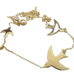 Gouden vogel bedelketting