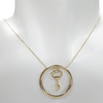 Gouden cirkel met sleutel hanger