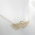 Gouden hart met zirkonia vleugels hanger