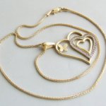 Gouden collier met zirkonia hanger