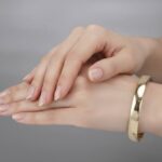 Christian slavenarmband 14 karaat goud