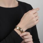 Gouden tricolor slavenarmband golvend model