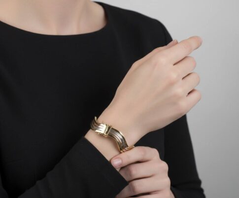 Gouden tricolor slavenarmband golvend model