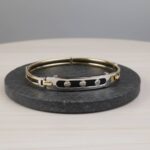 Gouden slavenarmband met leer