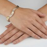 Christian gouden slavenarmband golvend model