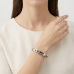 Gouden slavenarmband met leer