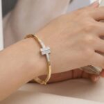 Bicolor goud Christian slavenarmband