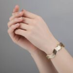 Gouden tricolor slavenarmband golvend model