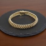 Gouden gevlochten armband
