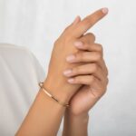 Christian slavenarmband goud