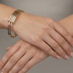 Bicolor gouden Christian slavenarmband