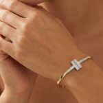 Bicolor goud Christian slavenarmband