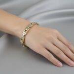 Dubbelzijdige bicolor gouden scharnierarmband