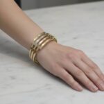 Gouden tricolor slavenarmband