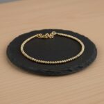 Gouden Christian balletjes armband