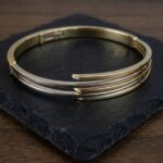 Bicolor gouden Christian slavenarmband