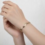 Gouden Christian slavenarmband golvend model