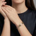 Bicolor gouden Christian slavenarmband