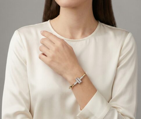 Bicolor goud Christian slavenarmband