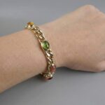 Gouden armband met amethist en toermalijn