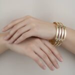 Gouden tricolor slavenarmband