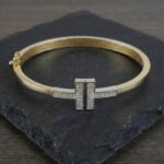 Bicolor goud Christian slavenarmband