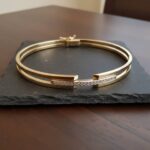 14 karaat Christian gouden bicolor armband