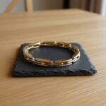 Dubbelzijdige bicolor gouden scharnierarmband