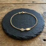 Gouden as armband