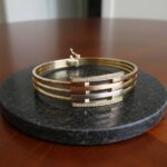 Gouden tricolor slavenarmband met zirkonia